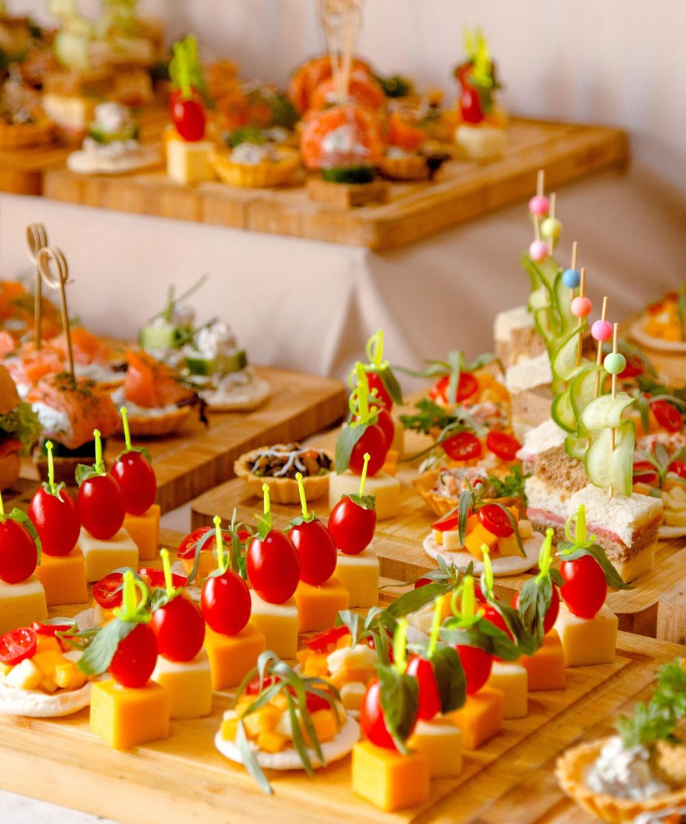 buffet-table-with-snacks-from-burgers-cheeses-etc-min